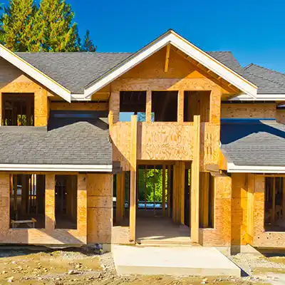 New construction home with new gray shingles installed